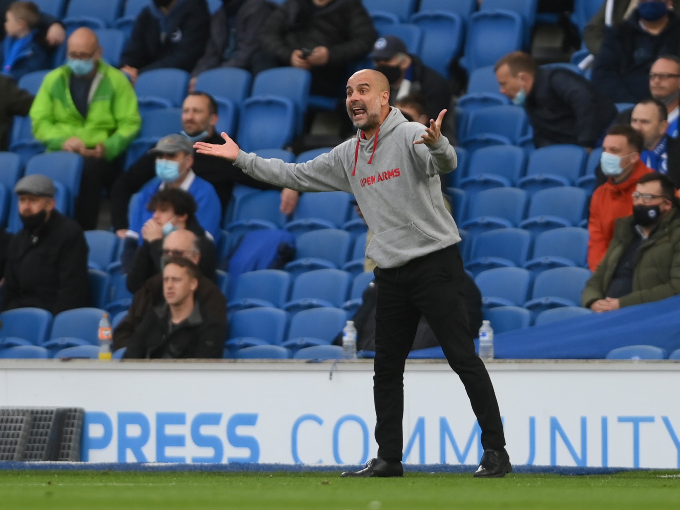 <p>Pep Guardiola saw his side’s away run come to an end at the Amex Stadium</p>