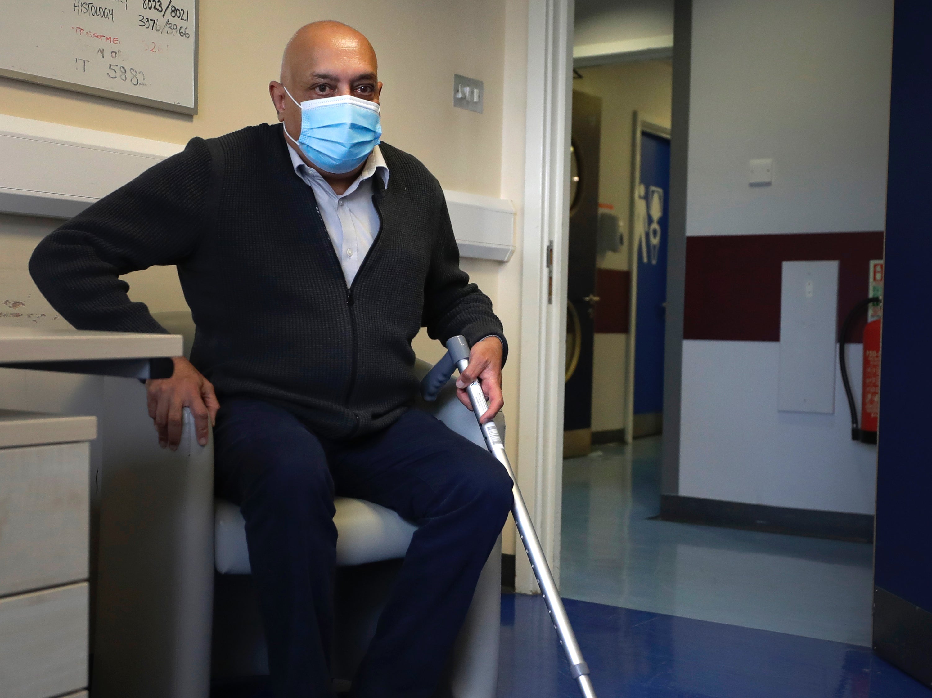 Long Covid patient Rohit Patel takes a seat during a visit to the Long Covid Clinic at King George Hospital in Ilford, London