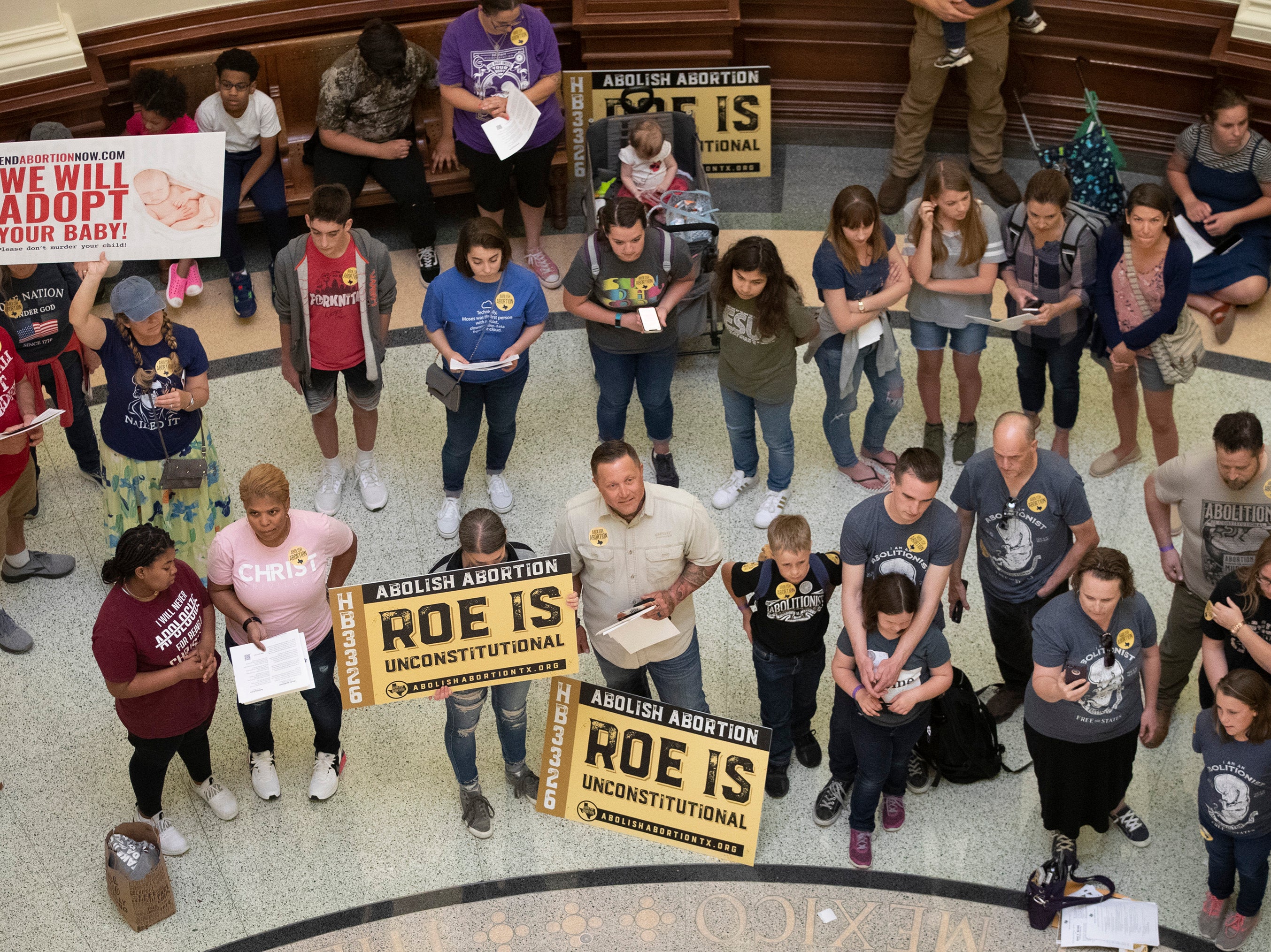 Pro-life demonstrators gather in the rotunda at the Capitol while the Senate debated anti-abortion bills in Austin, Texas
