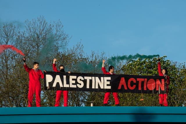 Protesters scaled the roof of the factory in Leicester