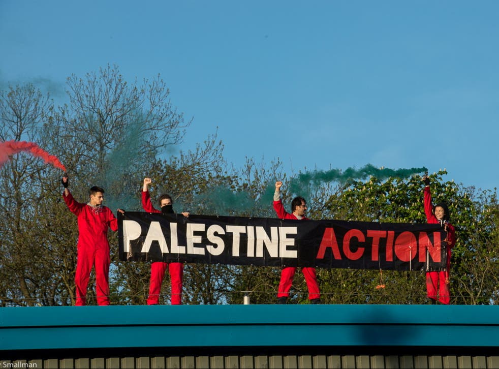Protesters scaled the roof of the factory in Leicester