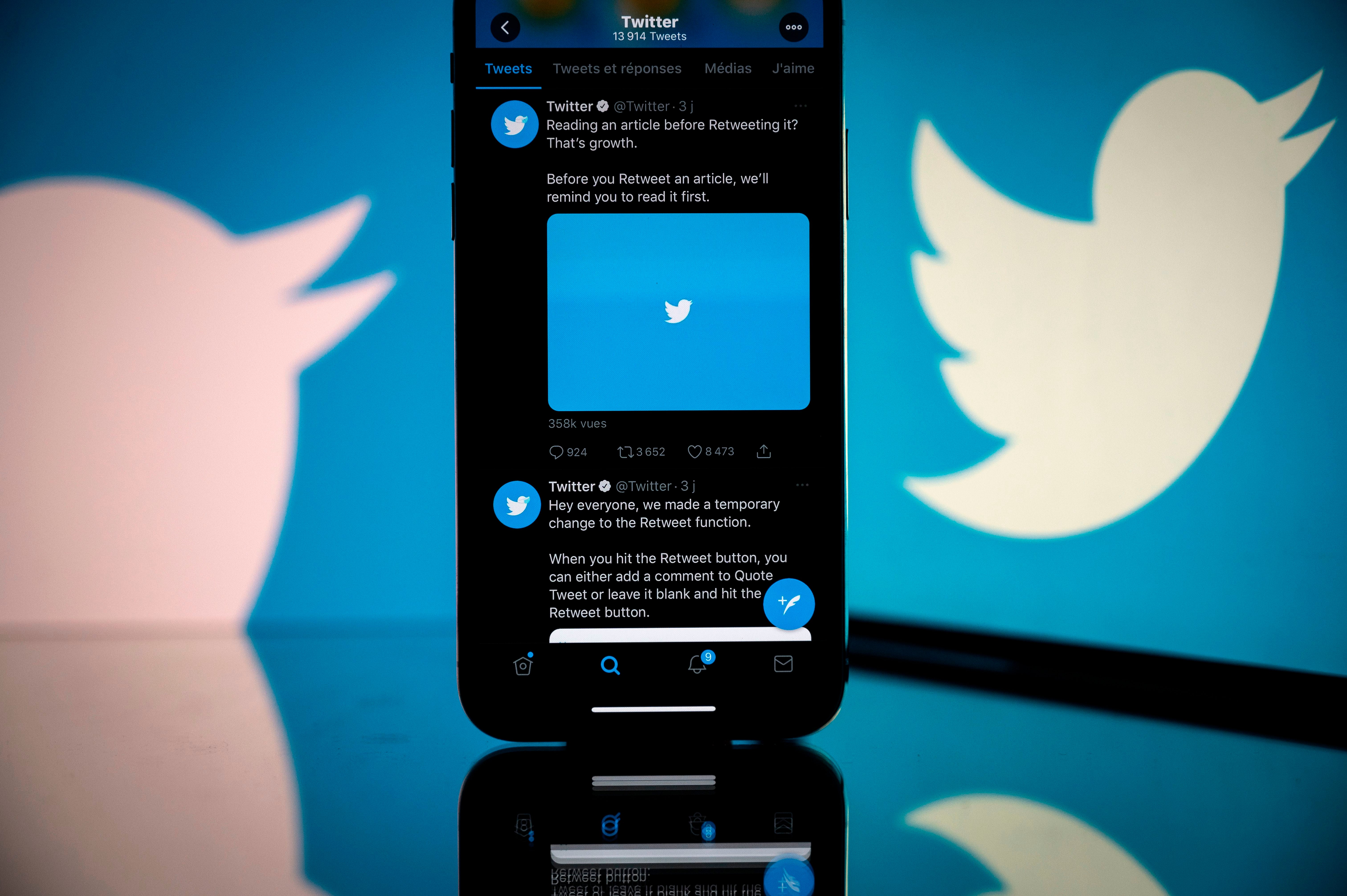 Twitter logo displayed on the screen of a smartphone and a tablet in Toulouse