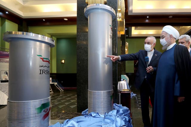 <p>Iranian president Hassan Rouhani (second right) visits an exhibition of Iran's nuclear achievements in Tehran</p>