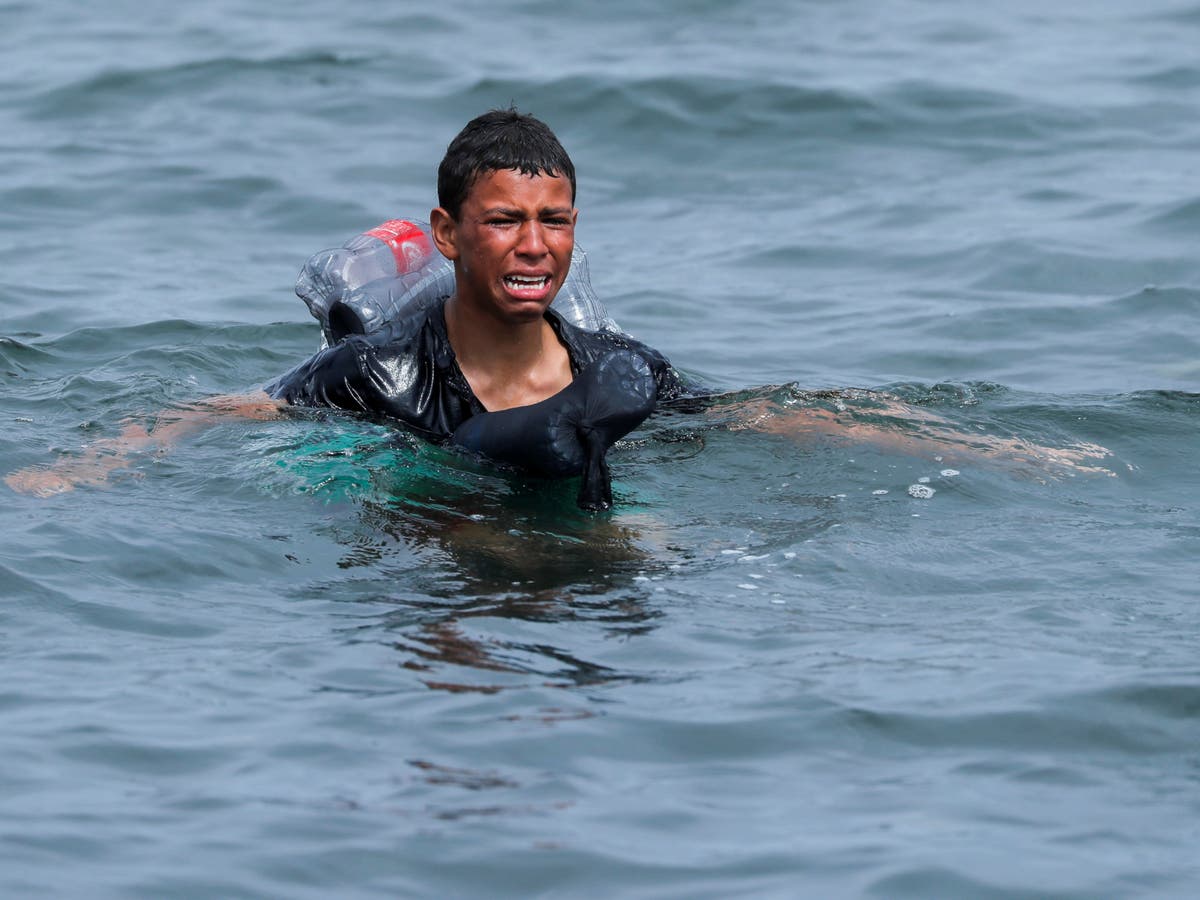 Young migrant uses plastic bottles to stay afloat as he tries to reach Ceuta