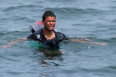 Young migrant uses plastic bottles to stay afloat as he tries to reach Ceuta