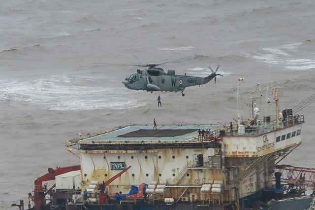 <p>Stranded workers from a barge, which had gone adrift amidst heavy rain and strong winds due to Cyclone Tauktae, being airlifted by naval personnel </p>