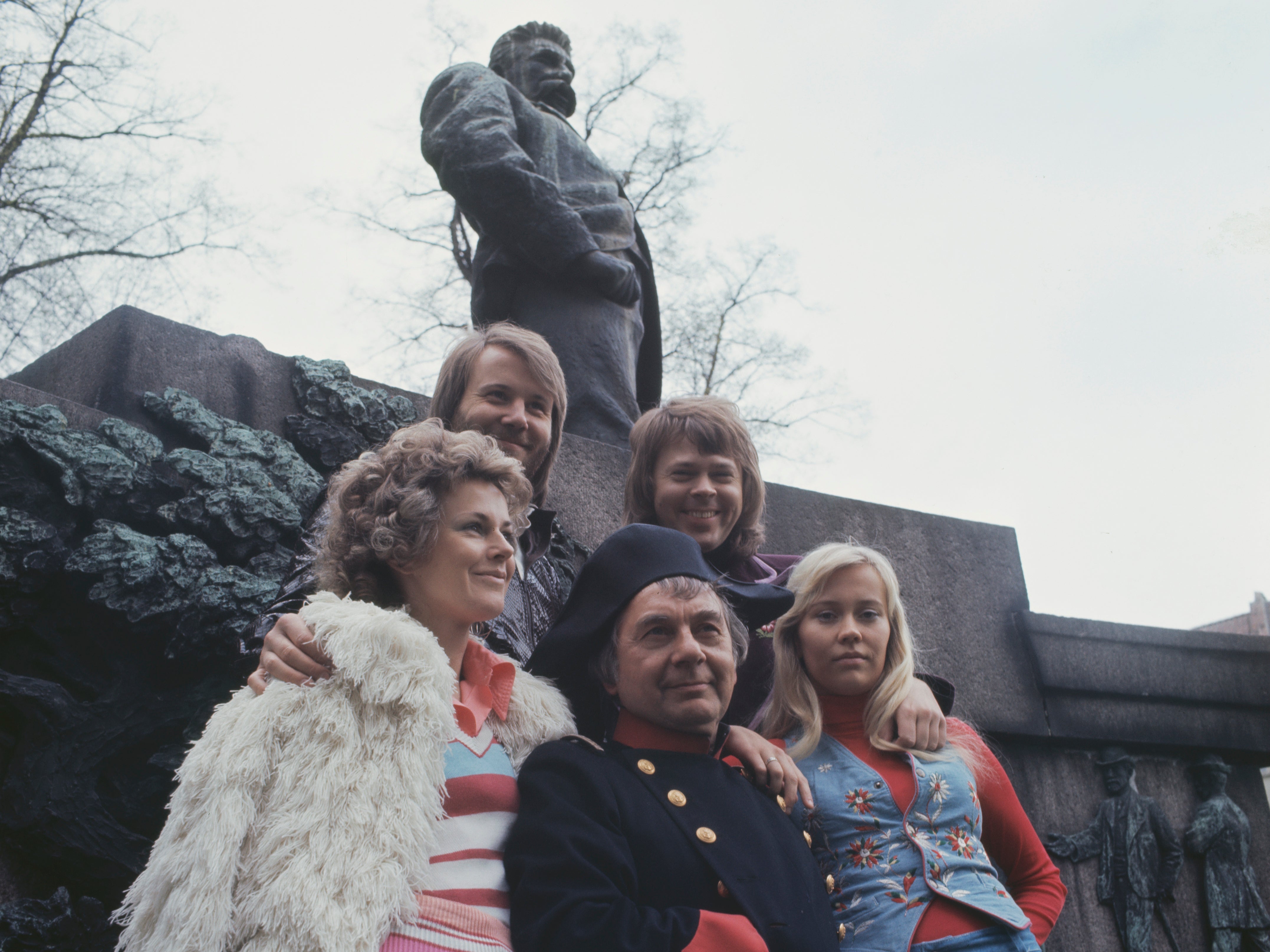An actor dressed as Napoleon Bonaparte poses with Swedish pop group Abba to promote their single 'Waterloo' in Copenhagen, Denmark, in 1974