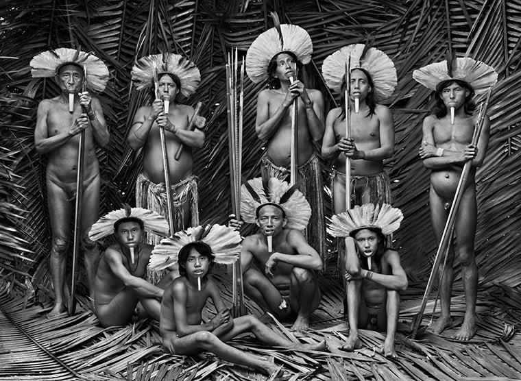 Men of Zo’é ethnicity, residents of the village of Towari Ypy, wearing traditional headdresses