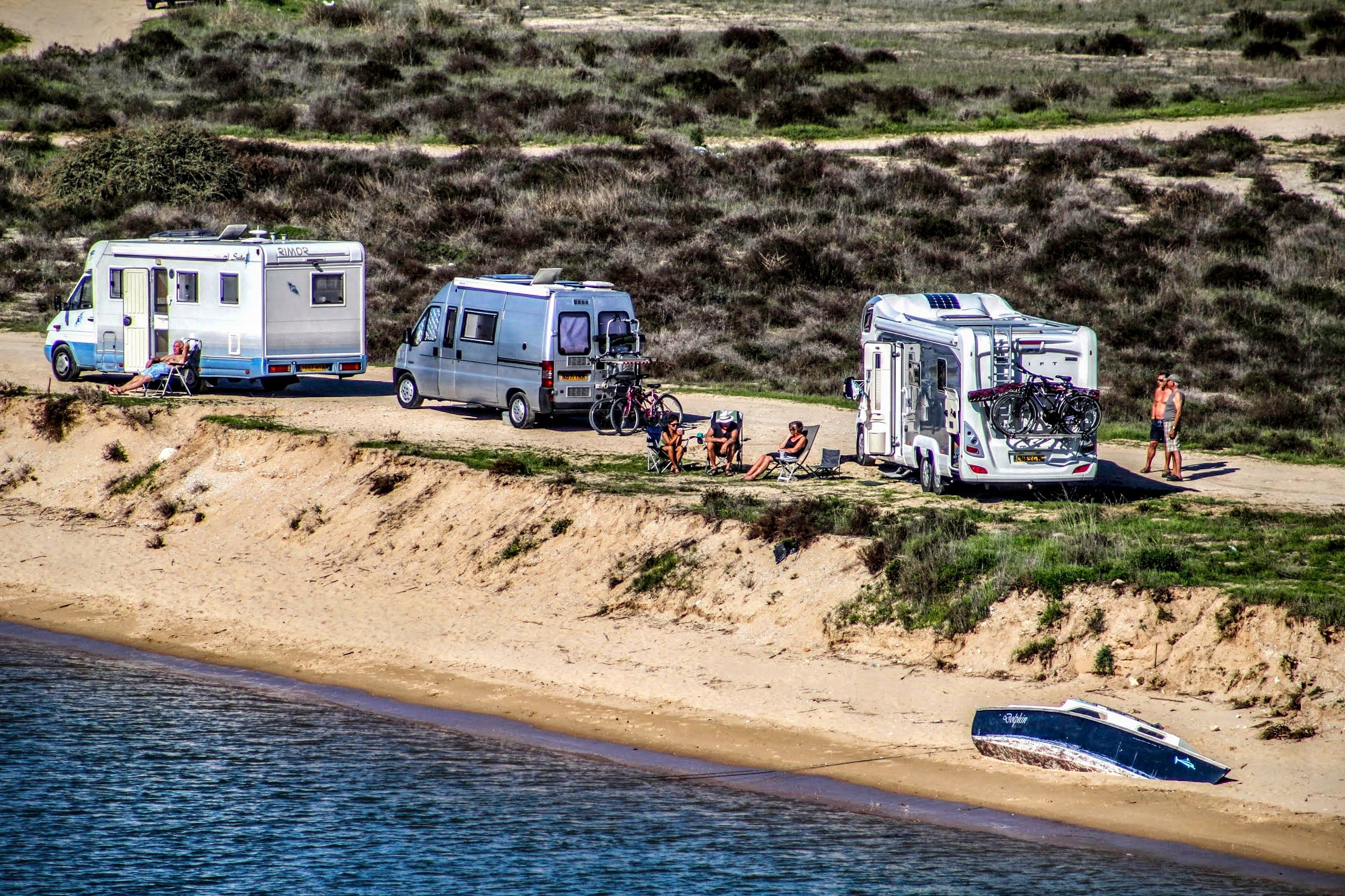 Motorhome tourists unfurl onto the beach in Portugal