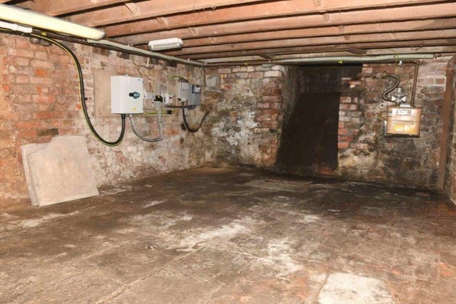 The cellar inside The Clean Plate cafe in Gloucester where excavation work is being carried out in the search for suspected Fred West victim Mary Bastholm