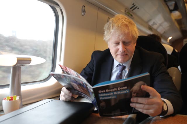 <p>Boris Johnson enjoys his 2019 election manifesto </p>