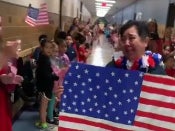 Maria Ponce, a cafeteria worker at Oliver Elementary School in Texas, walks through the halls of the school as students and teachers congratulate her on obtaining her US citizenship