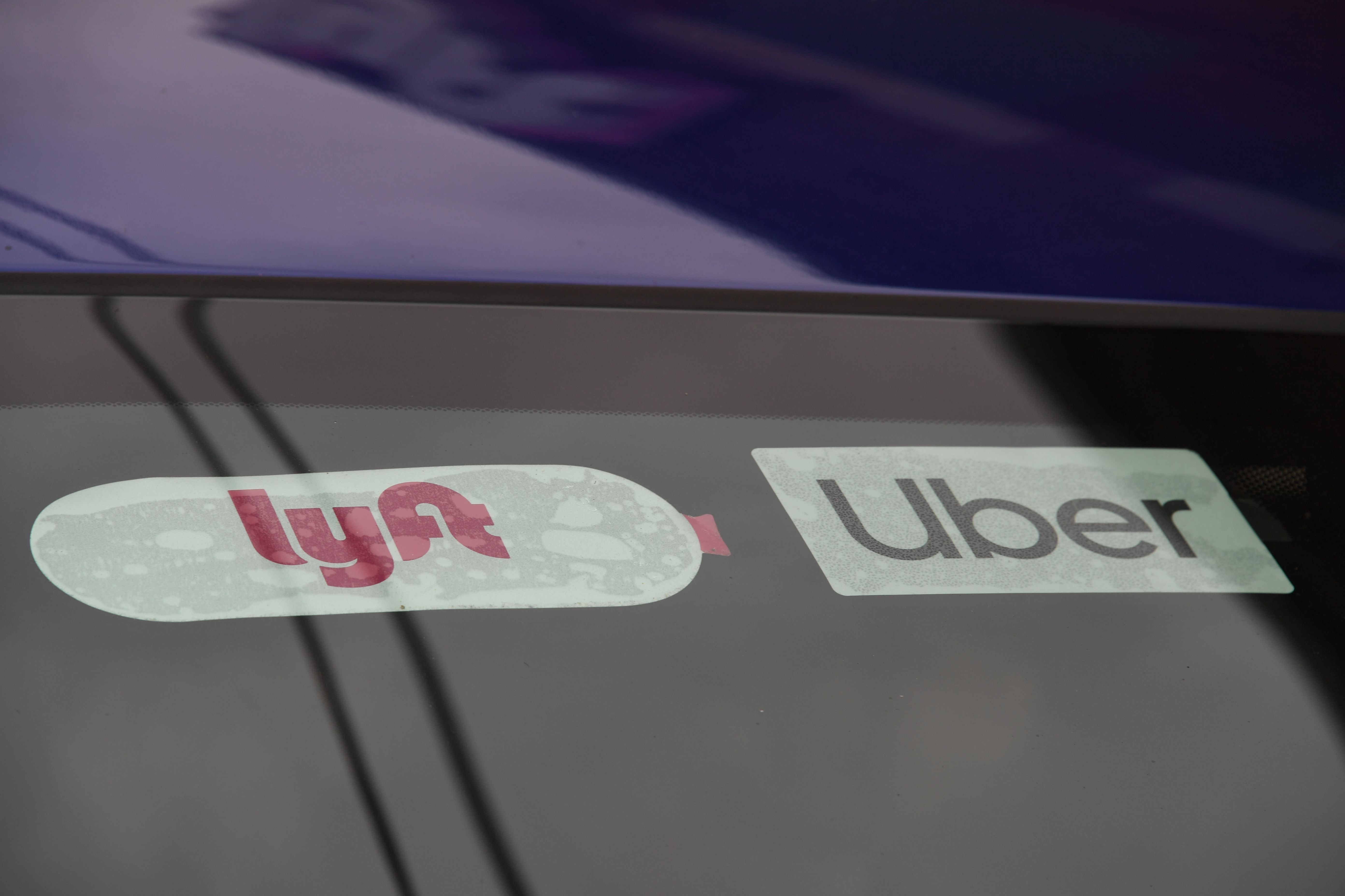 Rideshare drivers demonstrate against rideshare companies Uber and Lyft during a car caravan protest on August 6, 2020 in Los Angeles