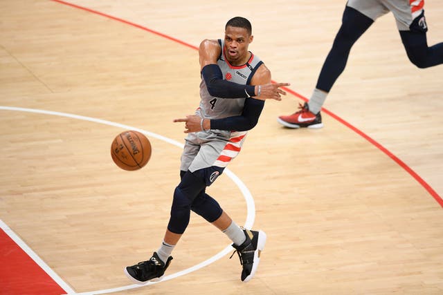 Washington Wizards guard Russell Westbrook passes the ball during the first half of the team’s NBA basketball Eastern Conference play-in game against the Indiana Pacers
