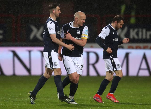 Dundee’s Charlie Adam (centre) celebrates scoring his side’s second goal of the game
