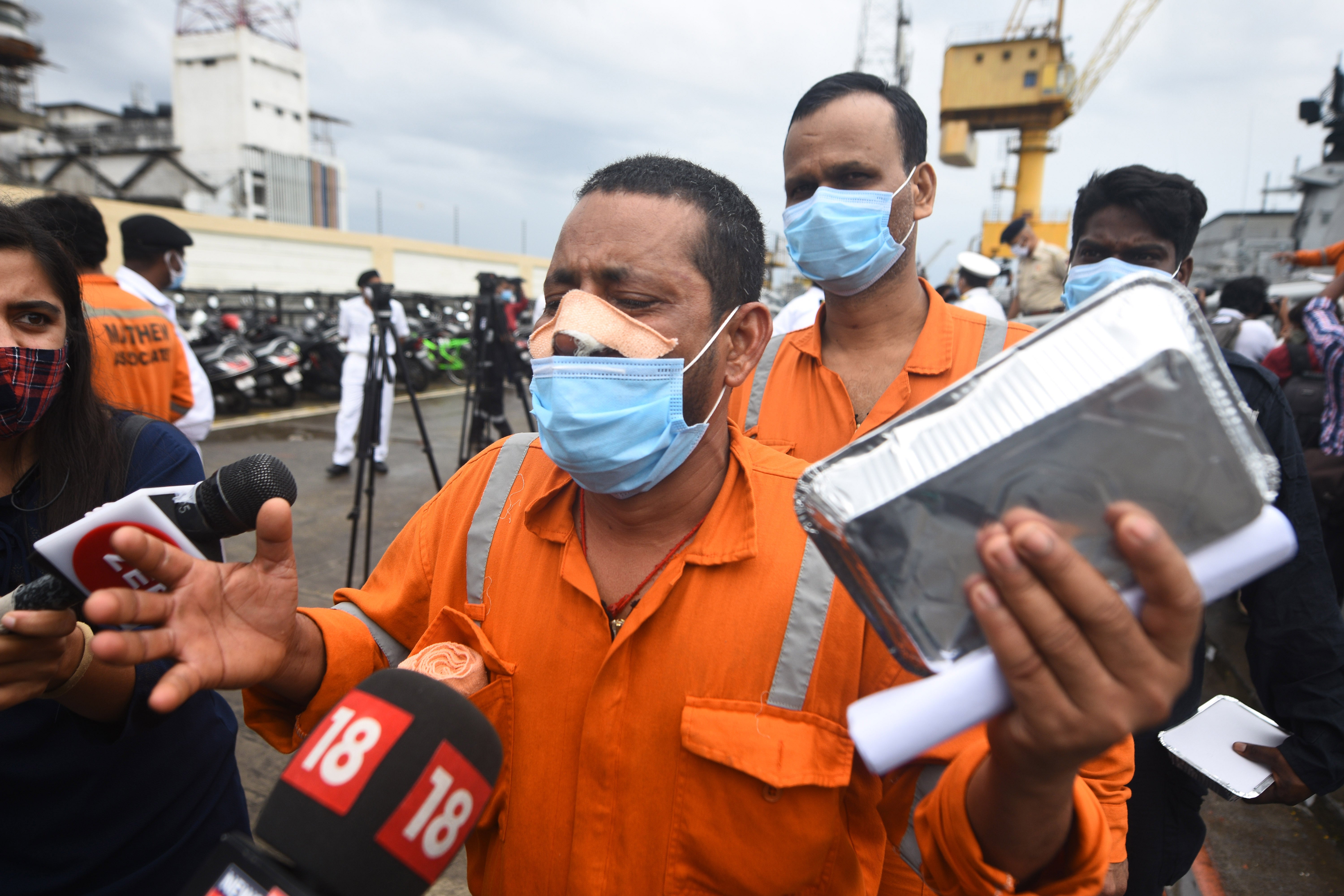 People rescued by the Indian navy from a barge