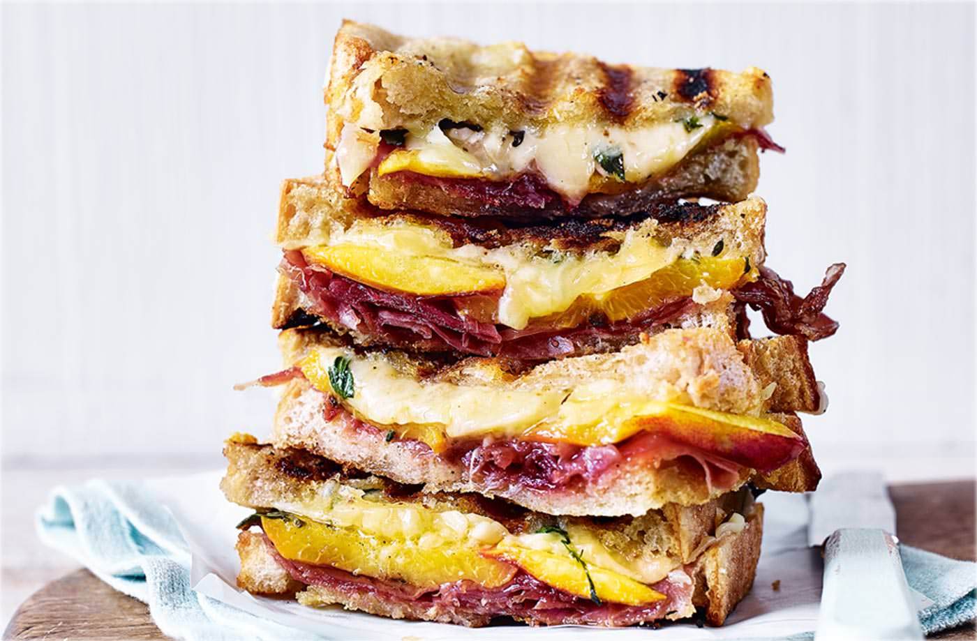 Sarnies don’t have to be strictly savoury affairs – Prosciutto, nectarine and thyme grilled cheese sandwich