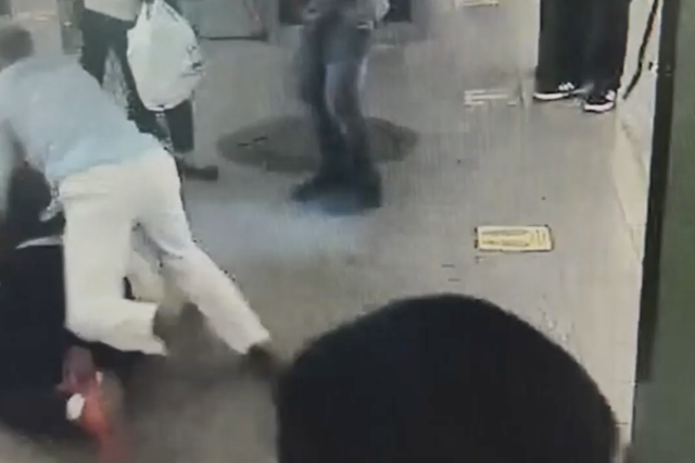 The moment a Good Samaritan jumped on a man who had suddenly begun stabbing a woman on a New York City subway platform