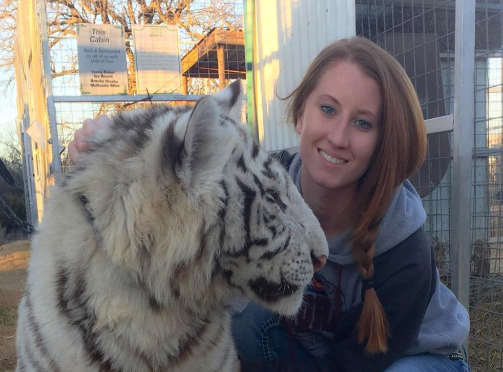 Lauren Lowe poses with a tiger