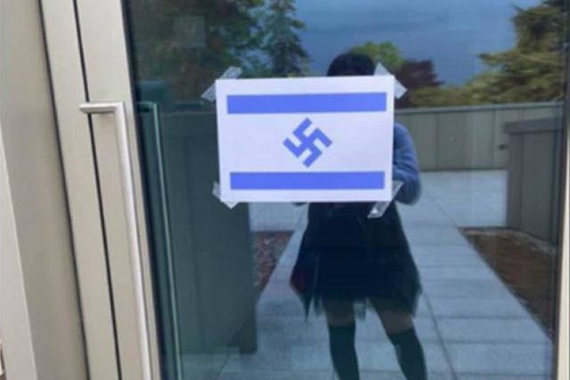 Police are investigating after posters of the Israel flag featuring a swastika were put up at Royal Holloway, University of London