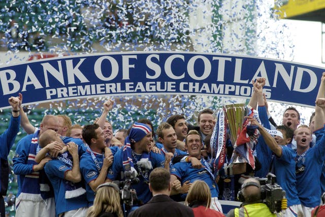 Rangers’ players celebrate with the SPL Trophy after defeating Hibernian 1-0