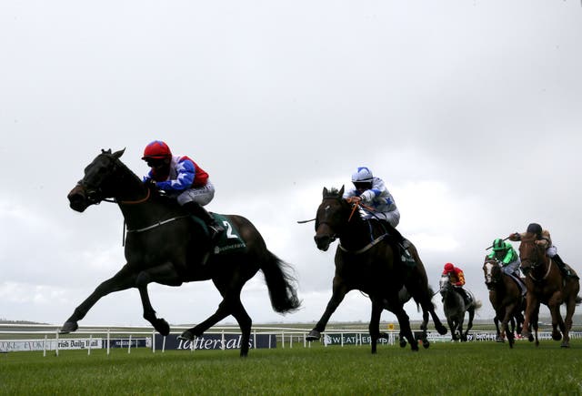 Gustavus Weston (left) on his way to winning the Weatherbys Ireland Greenlands Stakes