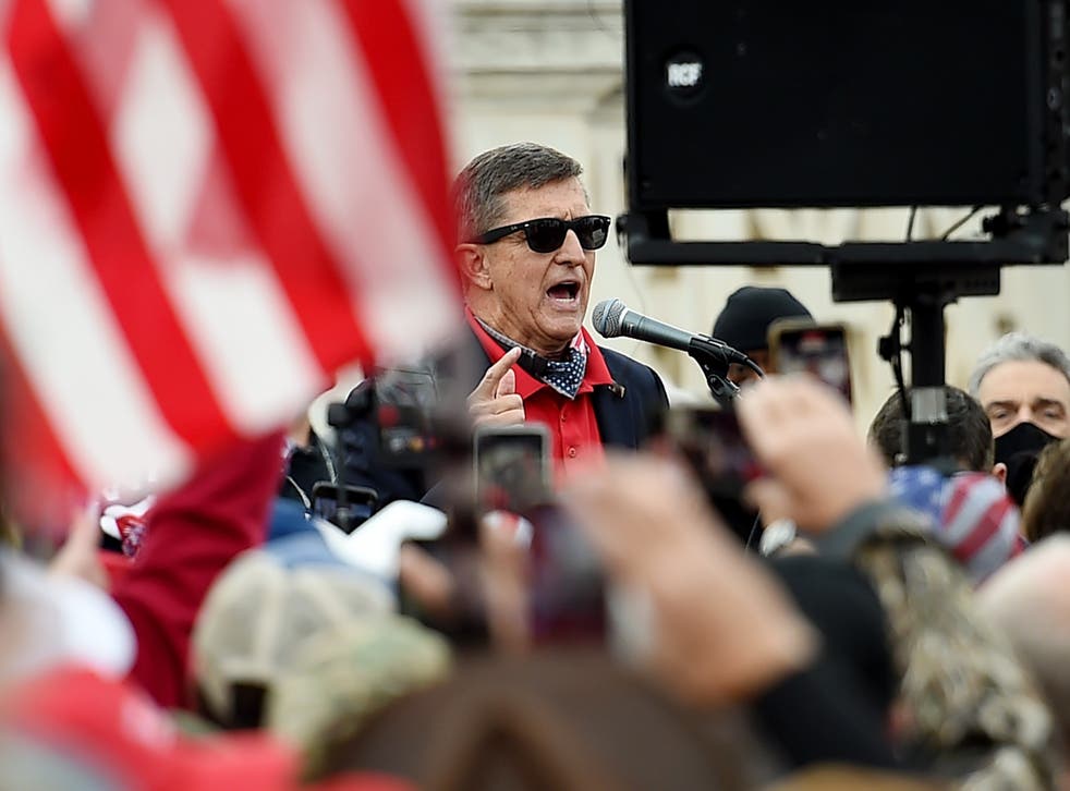 <p>Former US National Security Advisor Michael Flynn speaks to supporters of US President Donald Trump during the Million MAGA March to protest the outcome of the 2020 presidential election in front of the US Supreme Court on December 12, 2020 in Washington, DC. (</p>