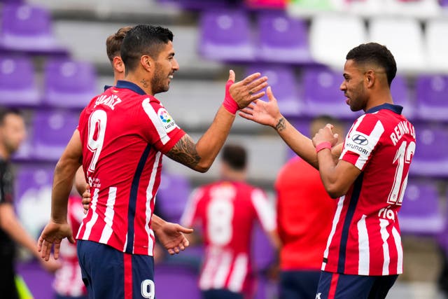 Luis Suarez, left, claimed the crucial goal as Atletico Madrid were crowned champions