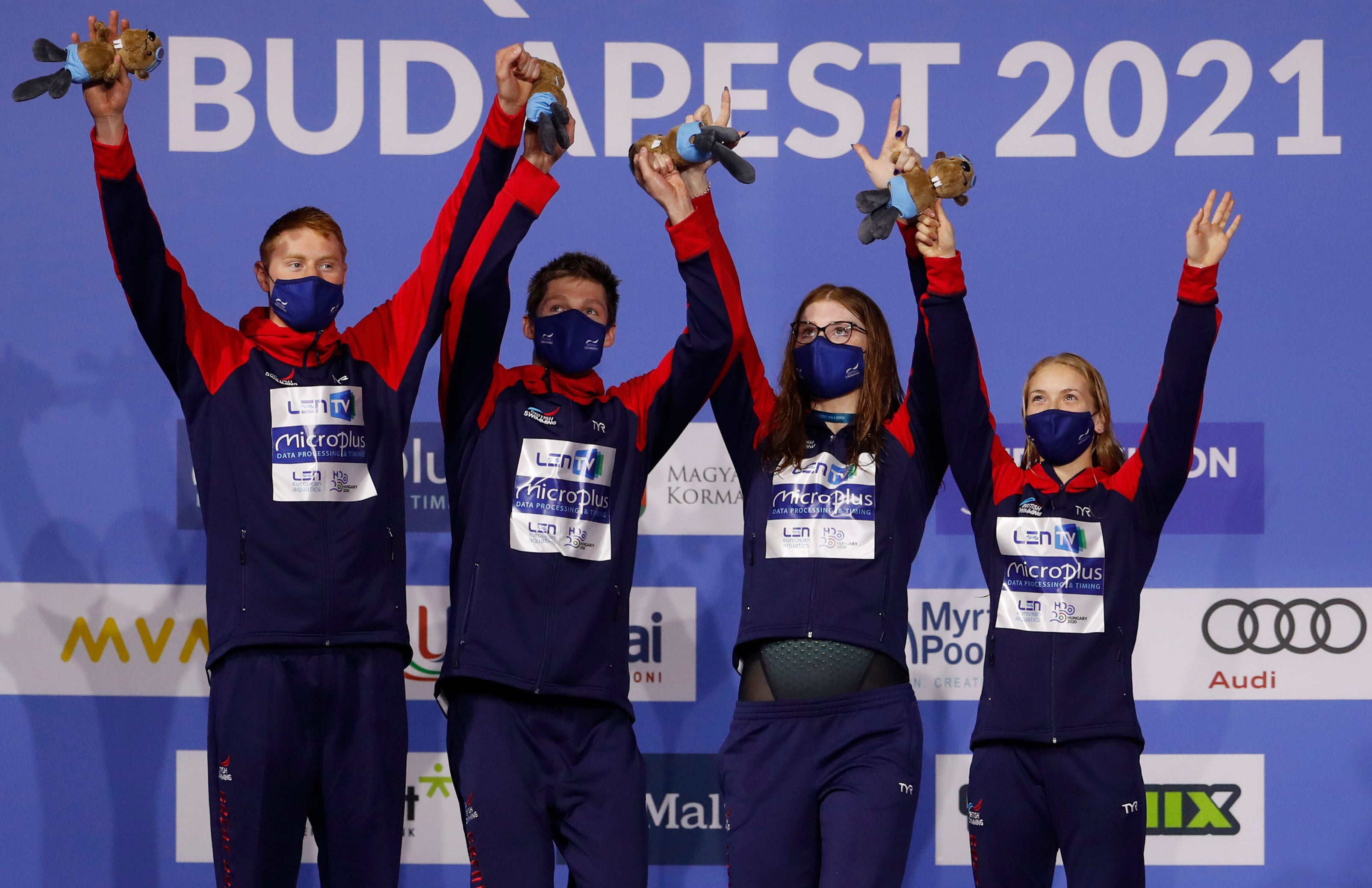 Great Britain celebrates after winning the mixed 4 x 100 metres relay final