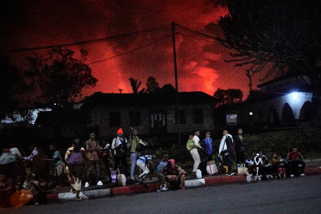 Congolese residents of Goma flee from Mount Nyiragongo volcano as it erupts