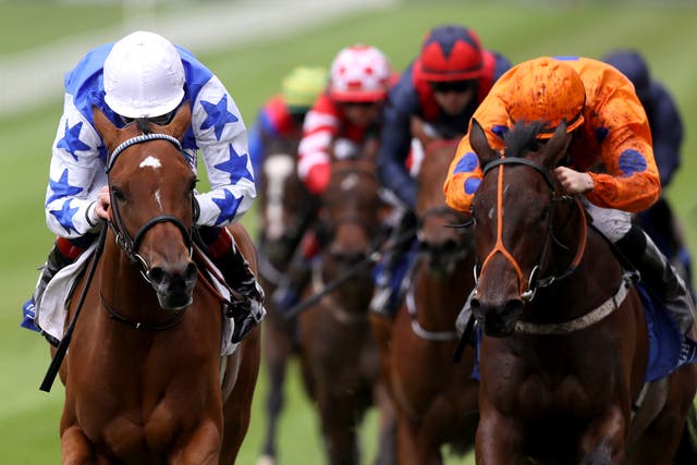 She's Trouble (left) winning at the Curragh