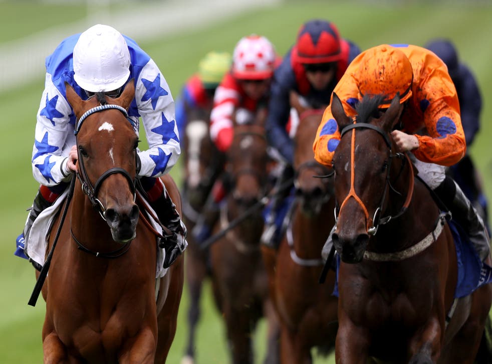 She's Trouble (left) winning at the Curragh