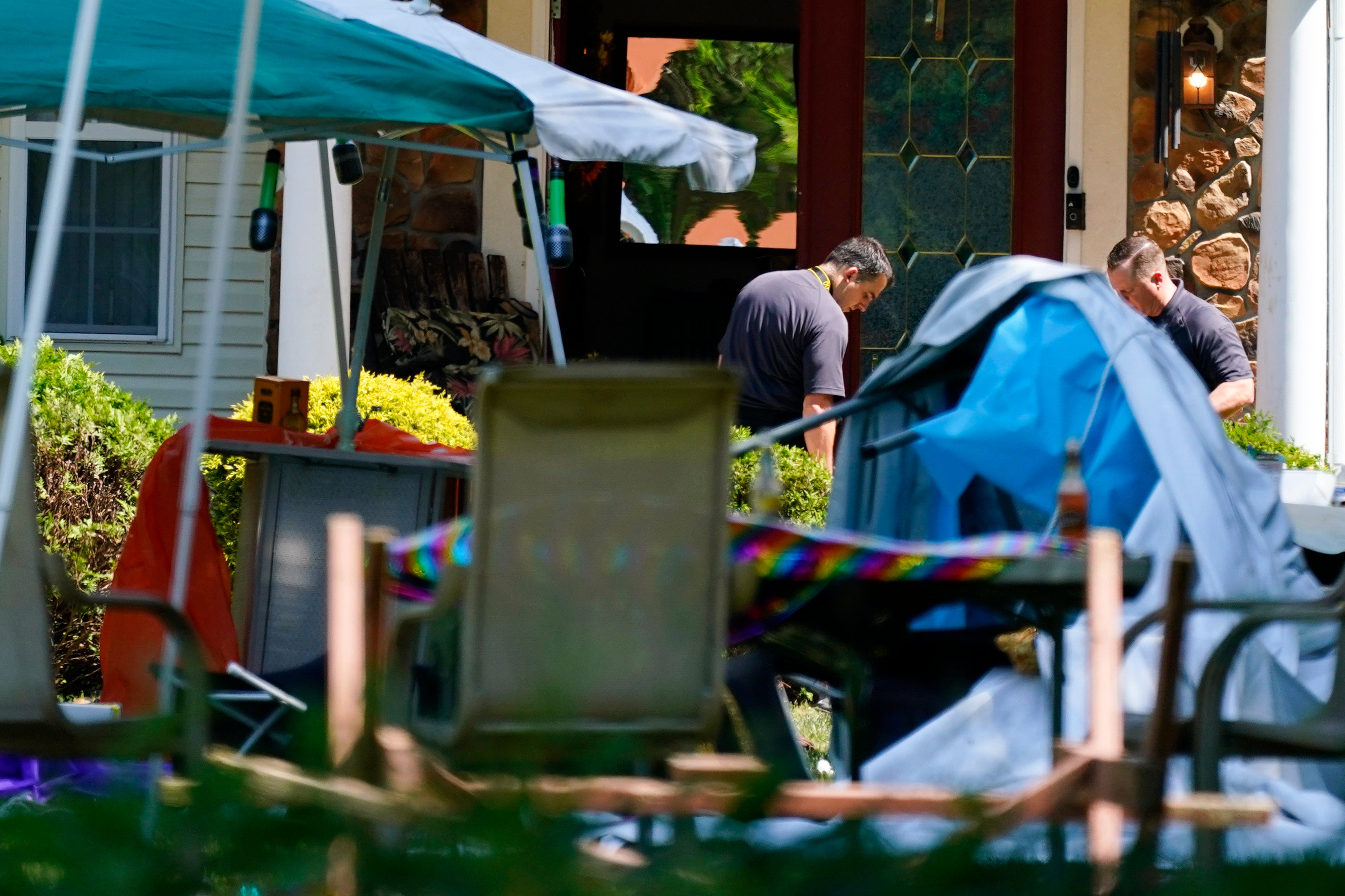 <p>Investigators works the scene of a shooting in Fairfield Township, N.J., Sunday, May 23, 2021</p>