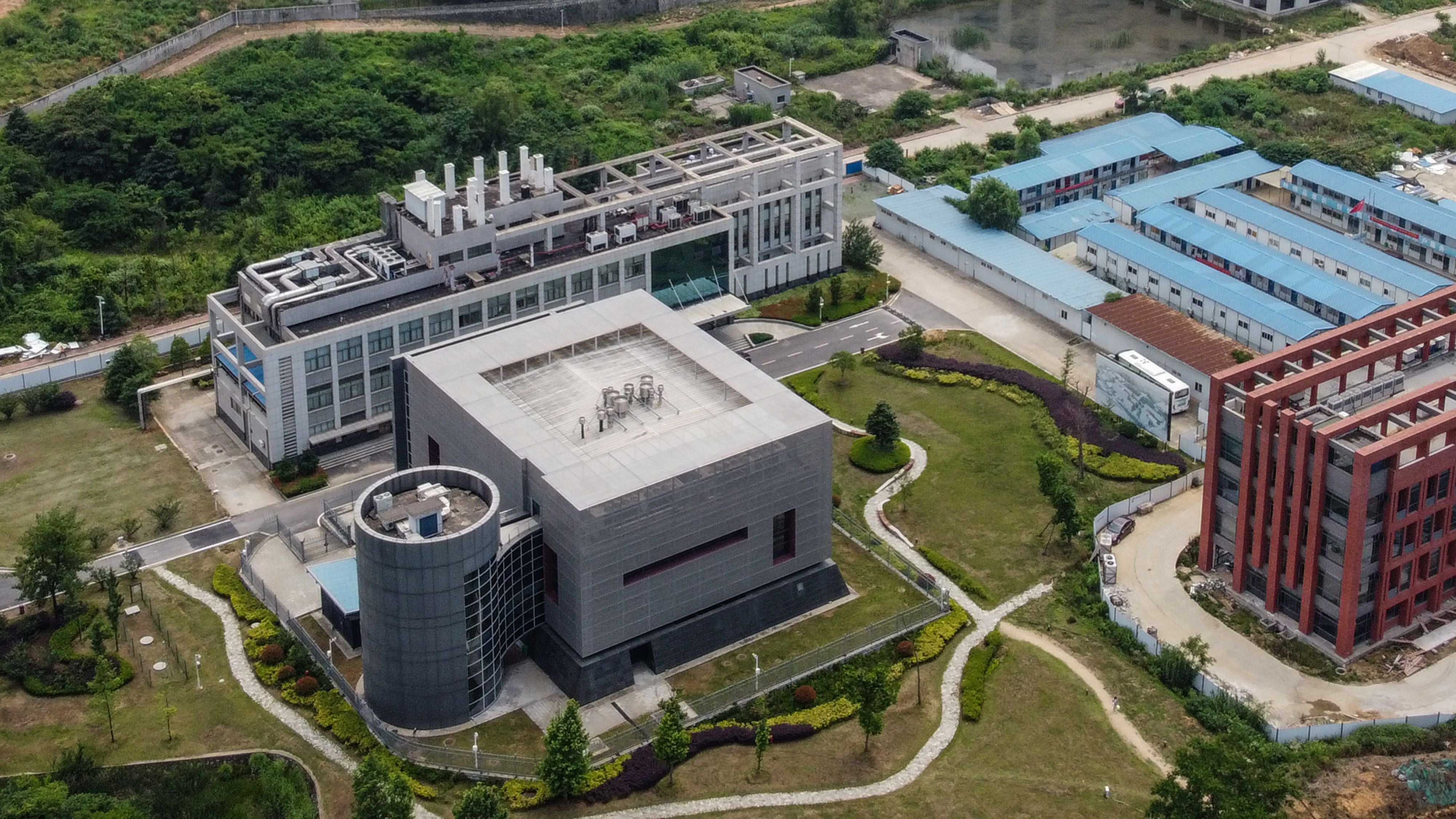 <p>This aerial view shows the P4 laboratory (L) on the campus of the Wuhan Institute of Virology in Wuhan in China's central Hubei province on May 27, 2020. </p>