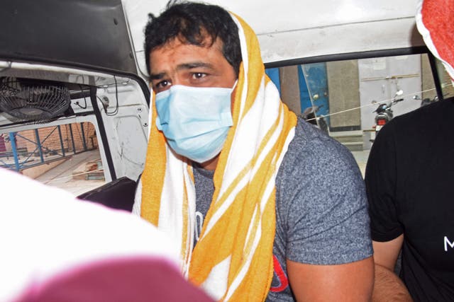 <p>Olympic wrestler Sushil Kumar sits inside a vehicle after his arrest in New Delhi on 23 May, 2021</p>