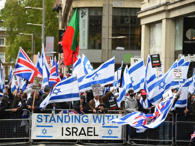 Hundreds of pro-Israel demonstrators gathered outside the Israeli embassy in London on Sunday for a rally