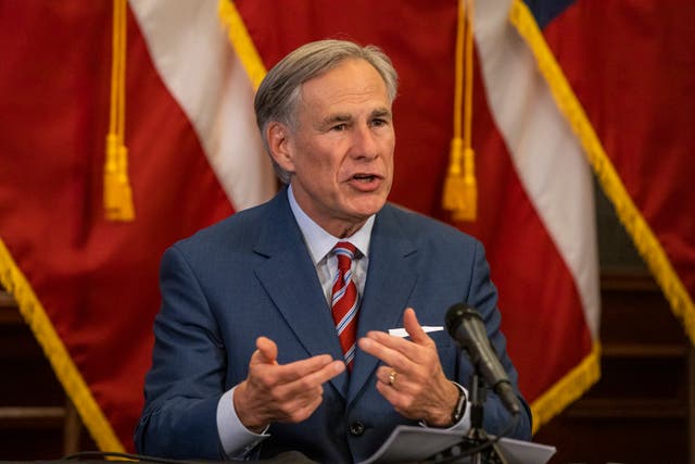 <p>Texas governor Greg Abbott, pictured at a pandemic press conference in May 2020, has vowed to pass a law punishing large cities for defunding the police</p>