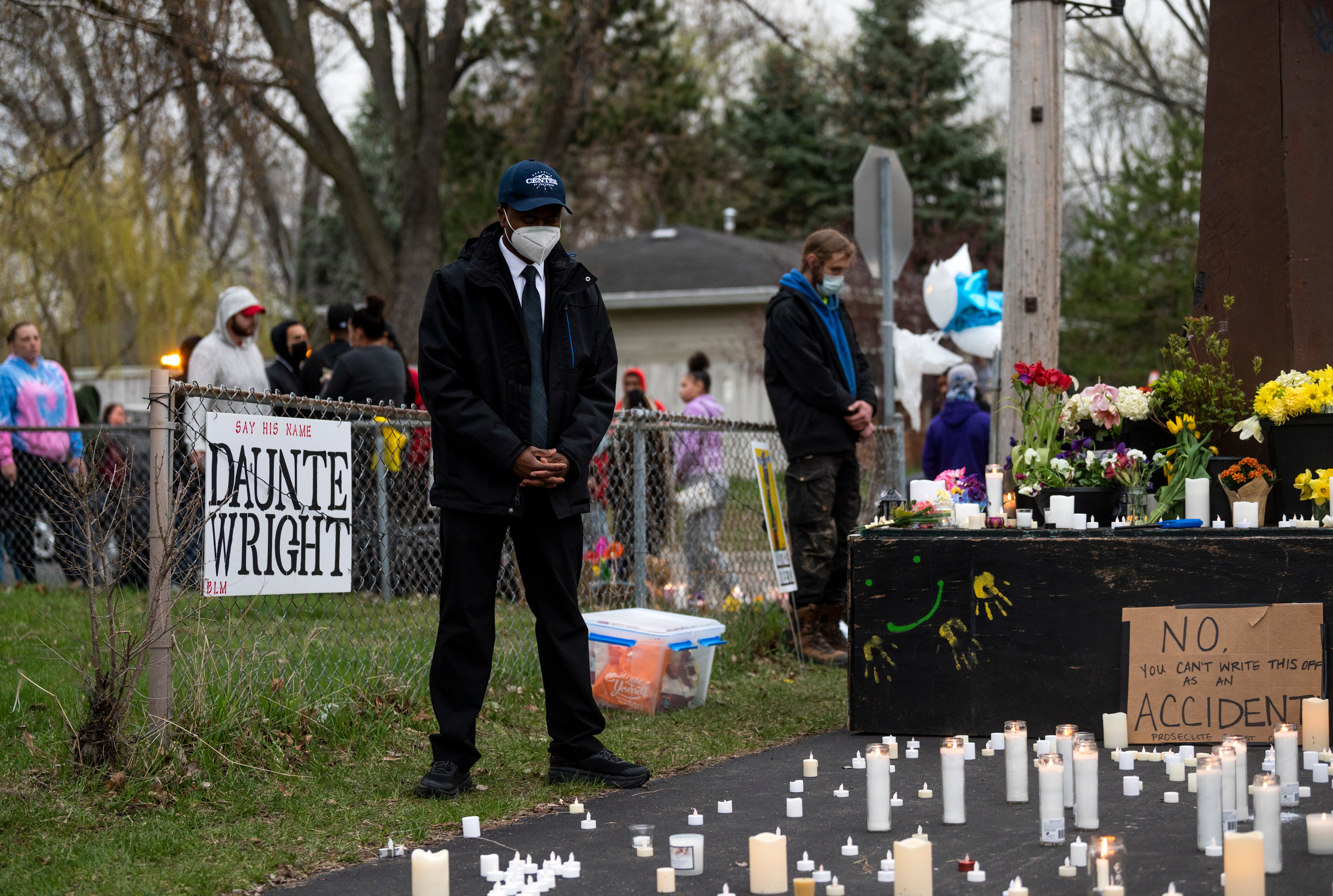 Brooklyn Center Mayor Mike Elliott visits a memorial site for Daunte Wright on April 14, 2021