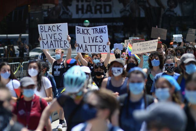 <p>Protesters march during a ‘Black Trans Lives Matter’ march against police brutality on 17 June, 2020, in the Brooklyn Borough of New York City. </p>