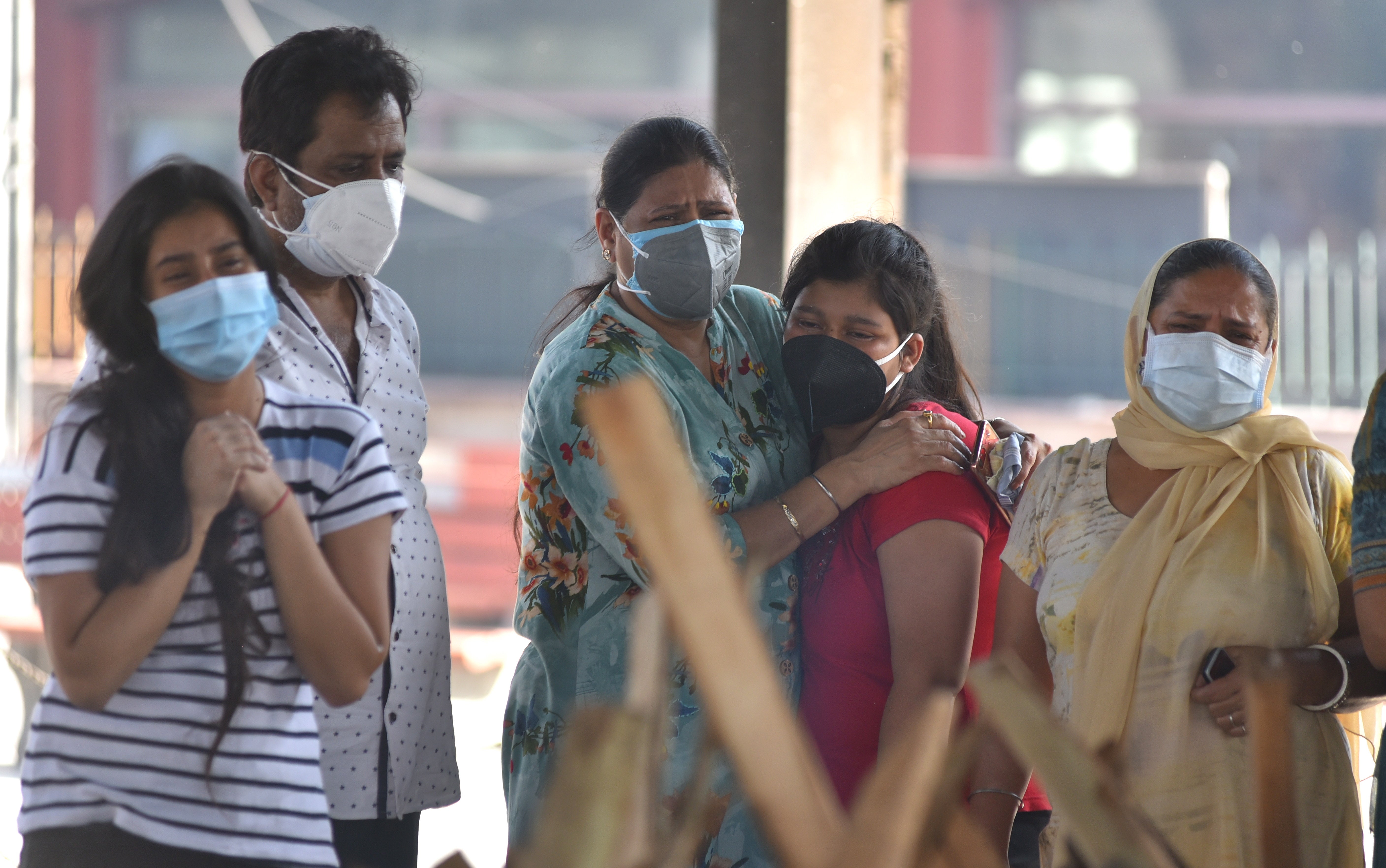 File: The family of a Covid-19 victim pay respects at a Delhi crematorium