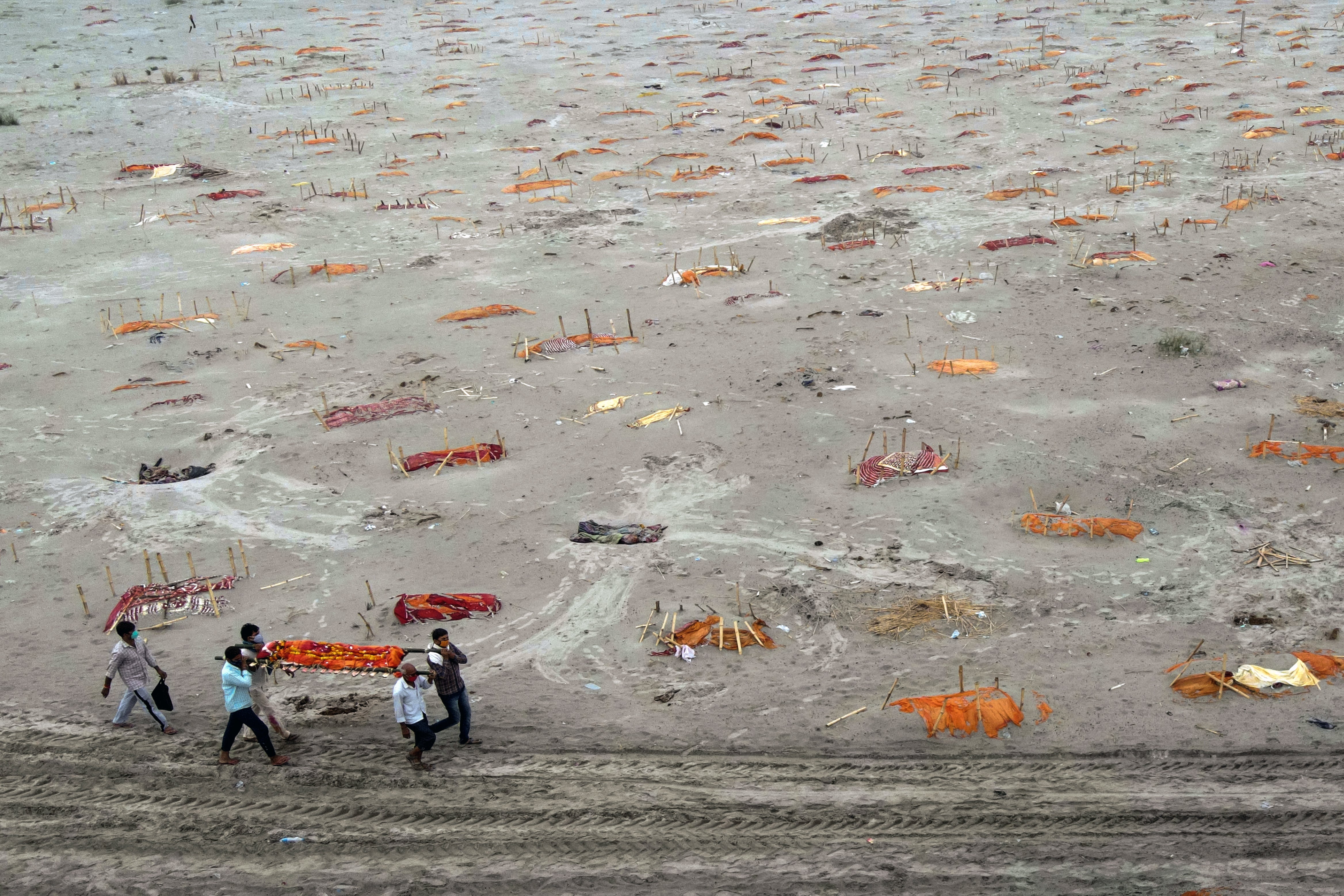 Morgues are overflowing because around the clock cremations and burials are insufficient