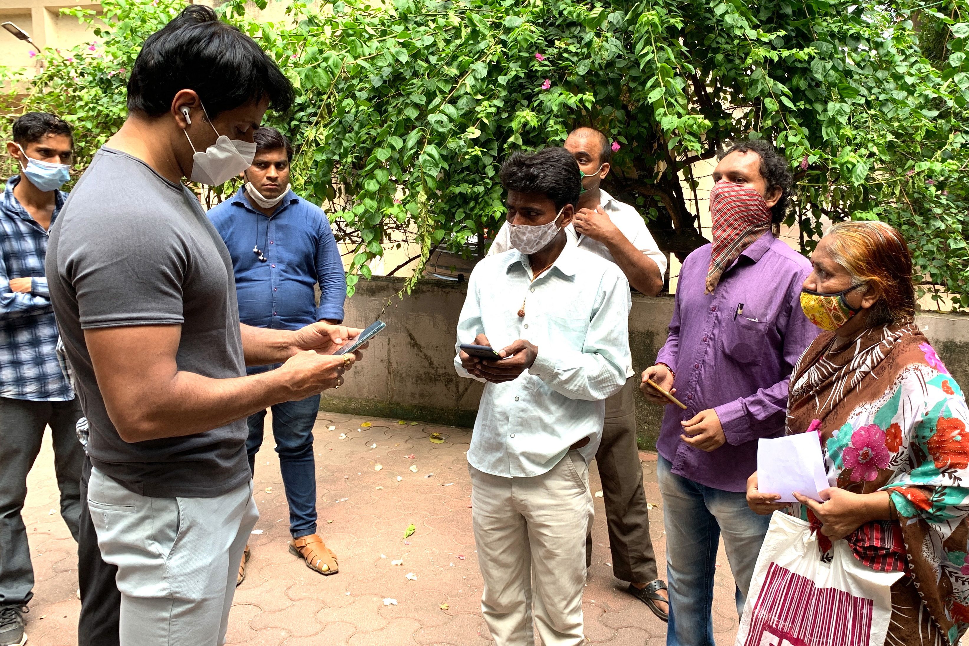 File image: Sonu Sood talks with needy people gathered outside his residence to request for medical and financial assistance amid Covid-19