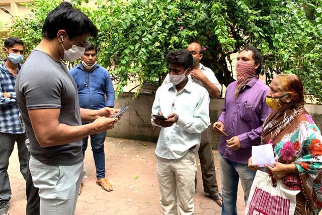<p>File image: Sonu Sood talks with needy people  gathered outside his residence to request for medical and financial assistance amid Covid-19</p>