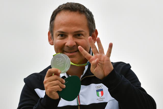 <p>Pellielo celebrates his silver medal on the podium  at the Rio 2016 Olympic Games</p>
