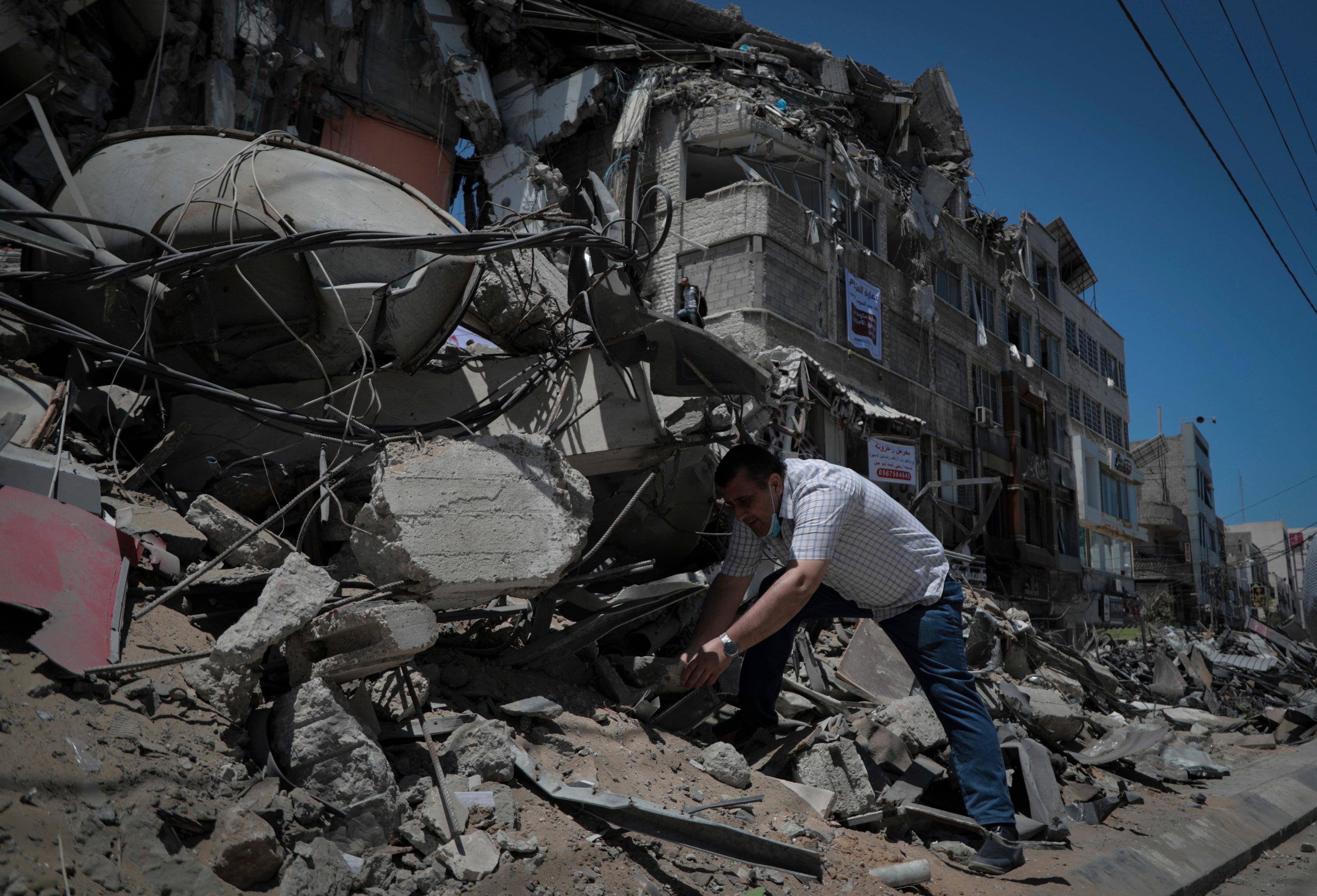 Naji Dwaima sifts through Al-Shorouk building rubble last Sunday