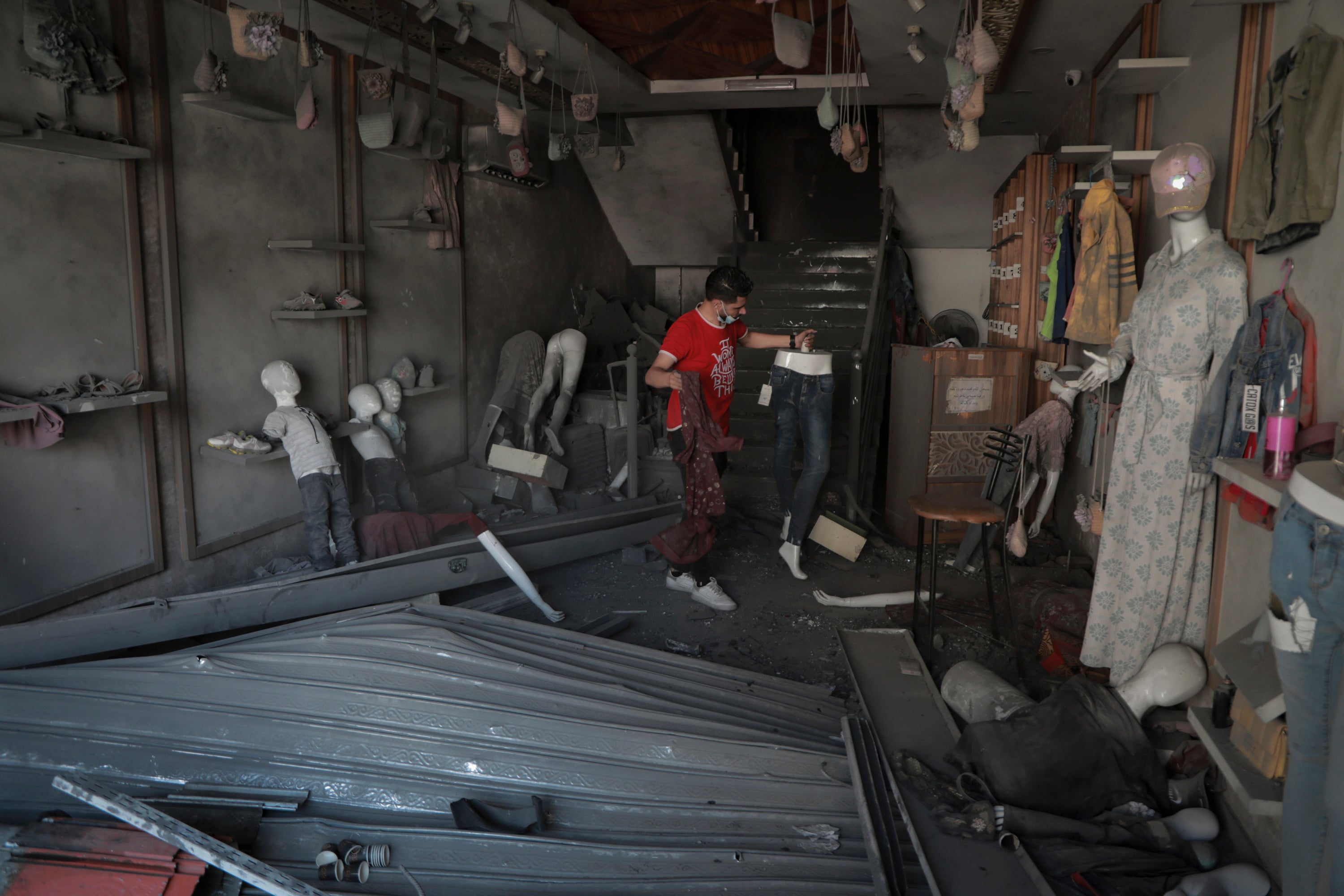 Bilal Mansour surveys his bombed-out shop