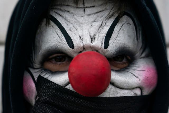 <p>A man in a clown costume</p>