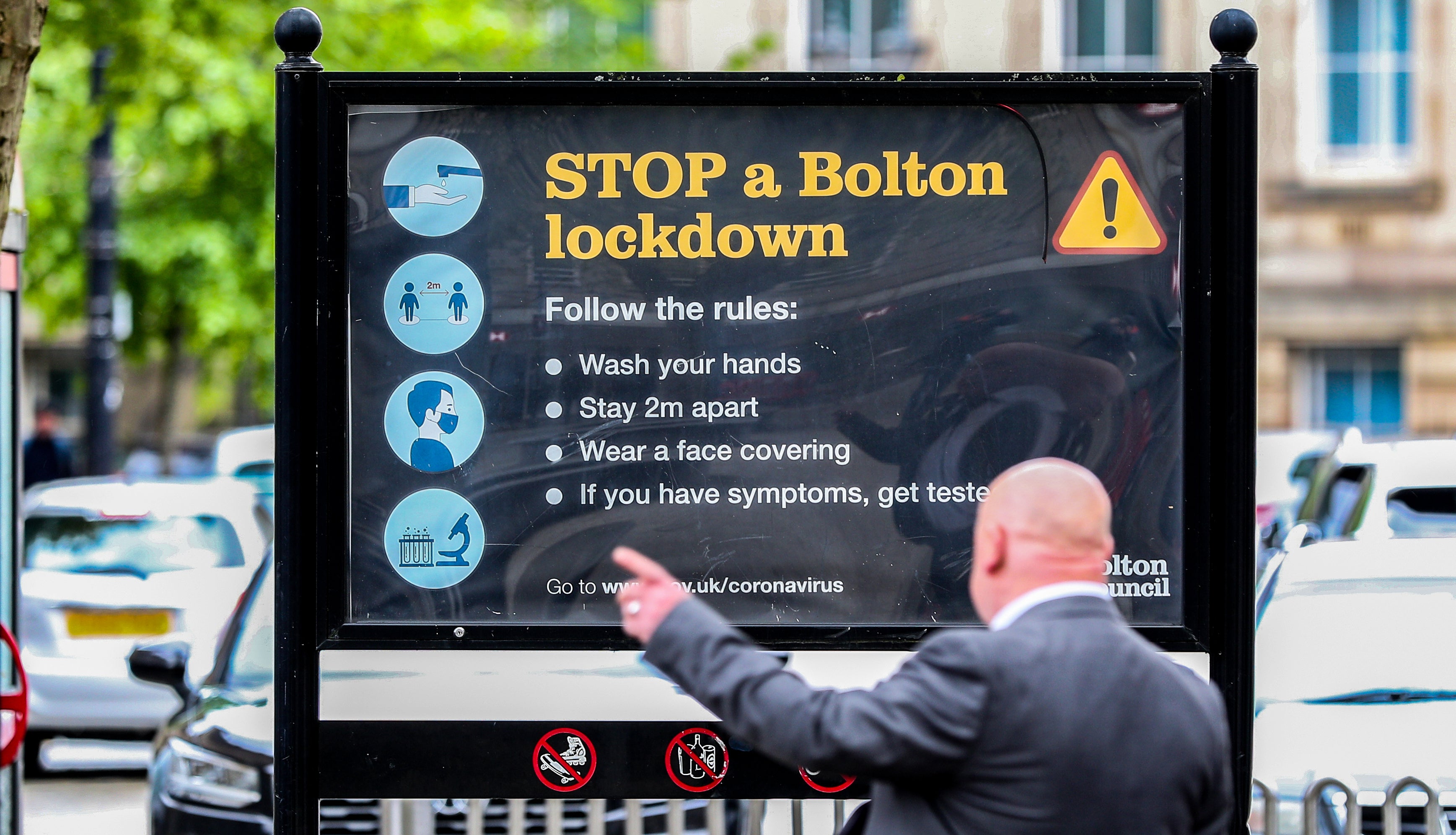 A man is photographed in Bolton town centre on 25 May, 2021.