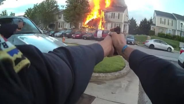 <p>A still from a Baltimore police officer’s body cam shows the shoot out on May 8 after a man allegedly set fire to his house and killed three neighbours</p>