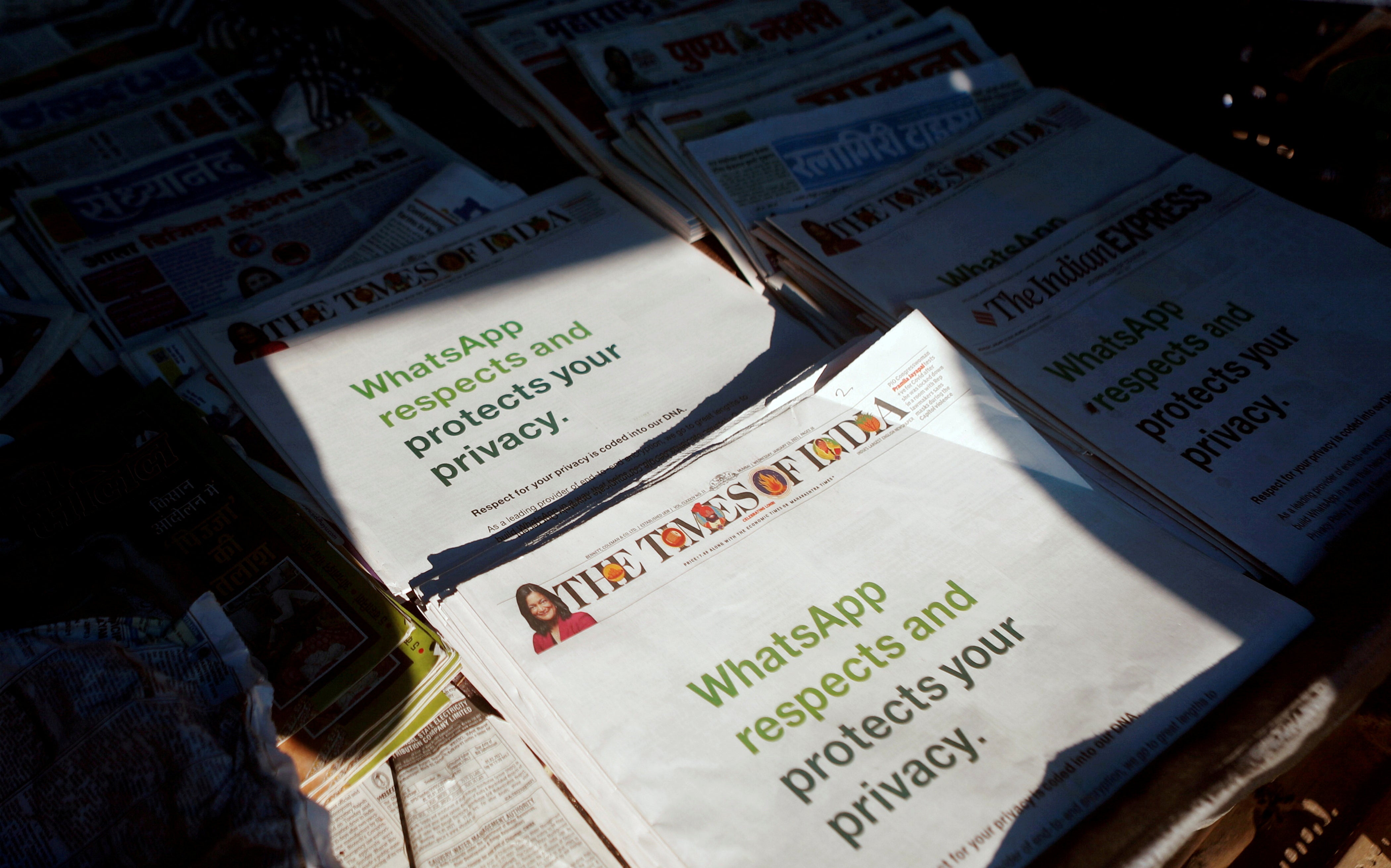 A WhatsApp advertisement on the front pages of newspapers at a stall in Mumbai, India, on 13 January, 2021